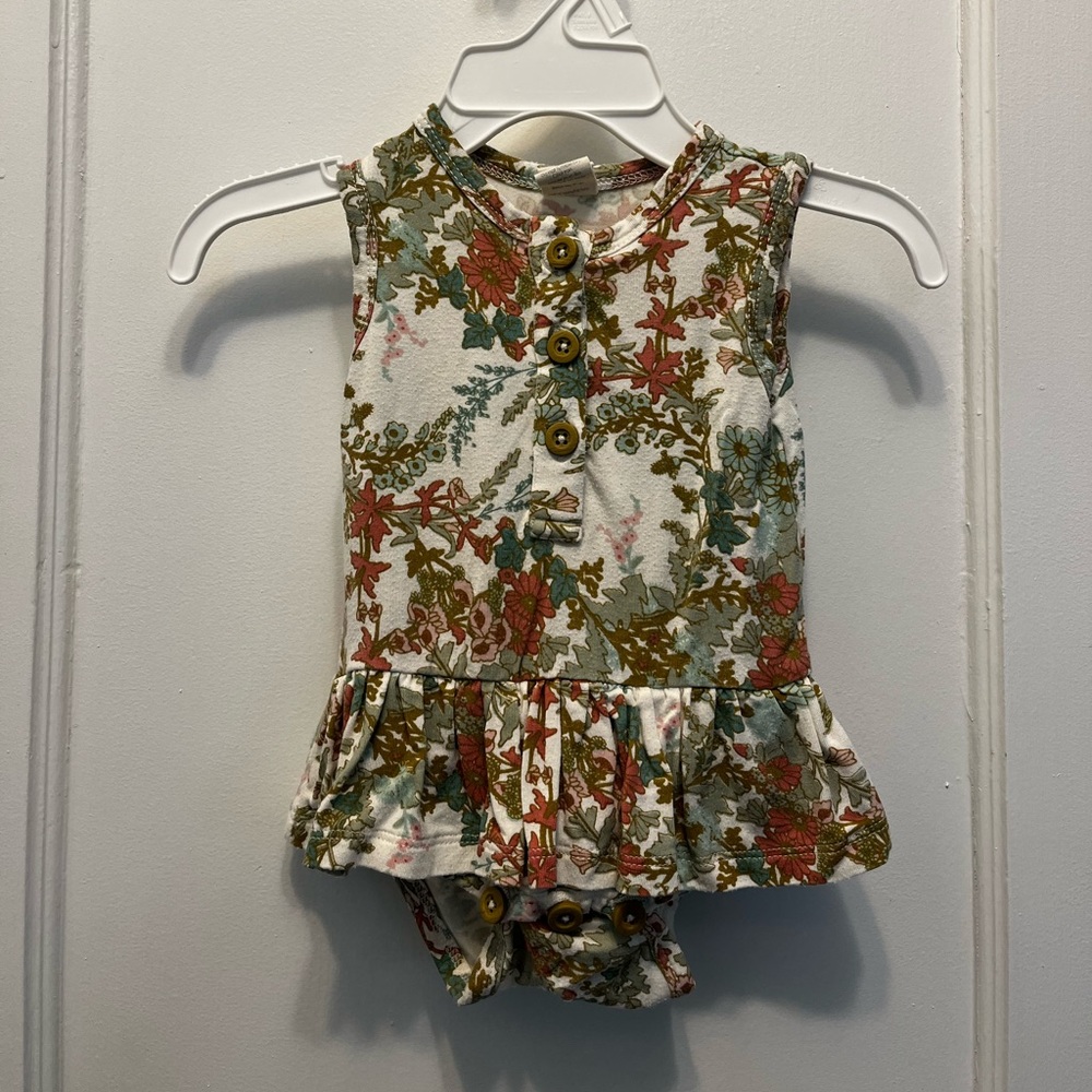 Kate Quinn ruffled onesie